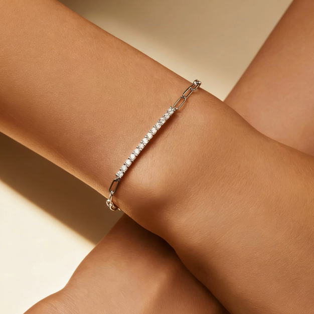 Silver paperclip chain crystal bar bracelet worn on wrist, minimalist pavé link jewelry for women