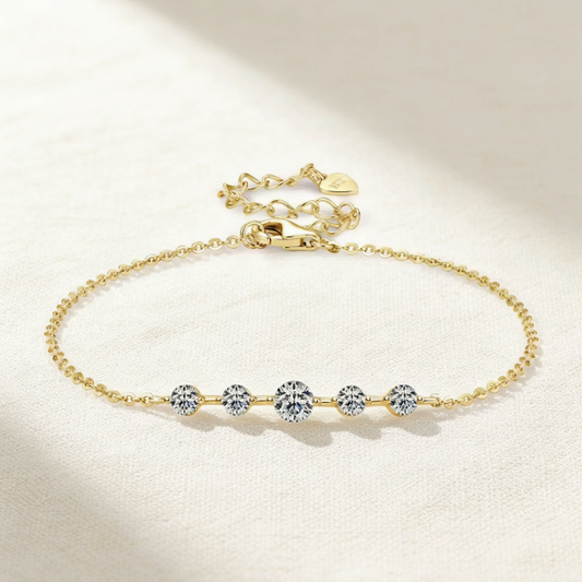 Gold gradient moissanite station bracelet with heart charm, minimalist central stone jewelry for women