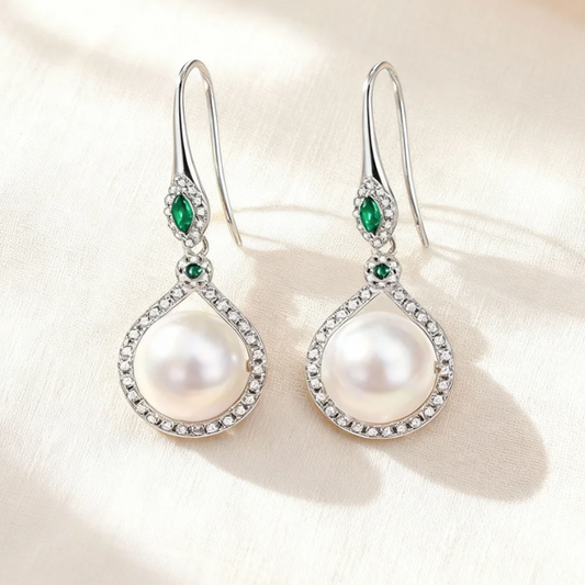 Silver pearl drop earrings with emerald accents, elegant hook style jewelry for women