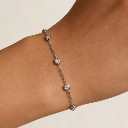 Silver round crystal by-the-yard bracelet worn on wrist, minimalist station chain jewelry for women